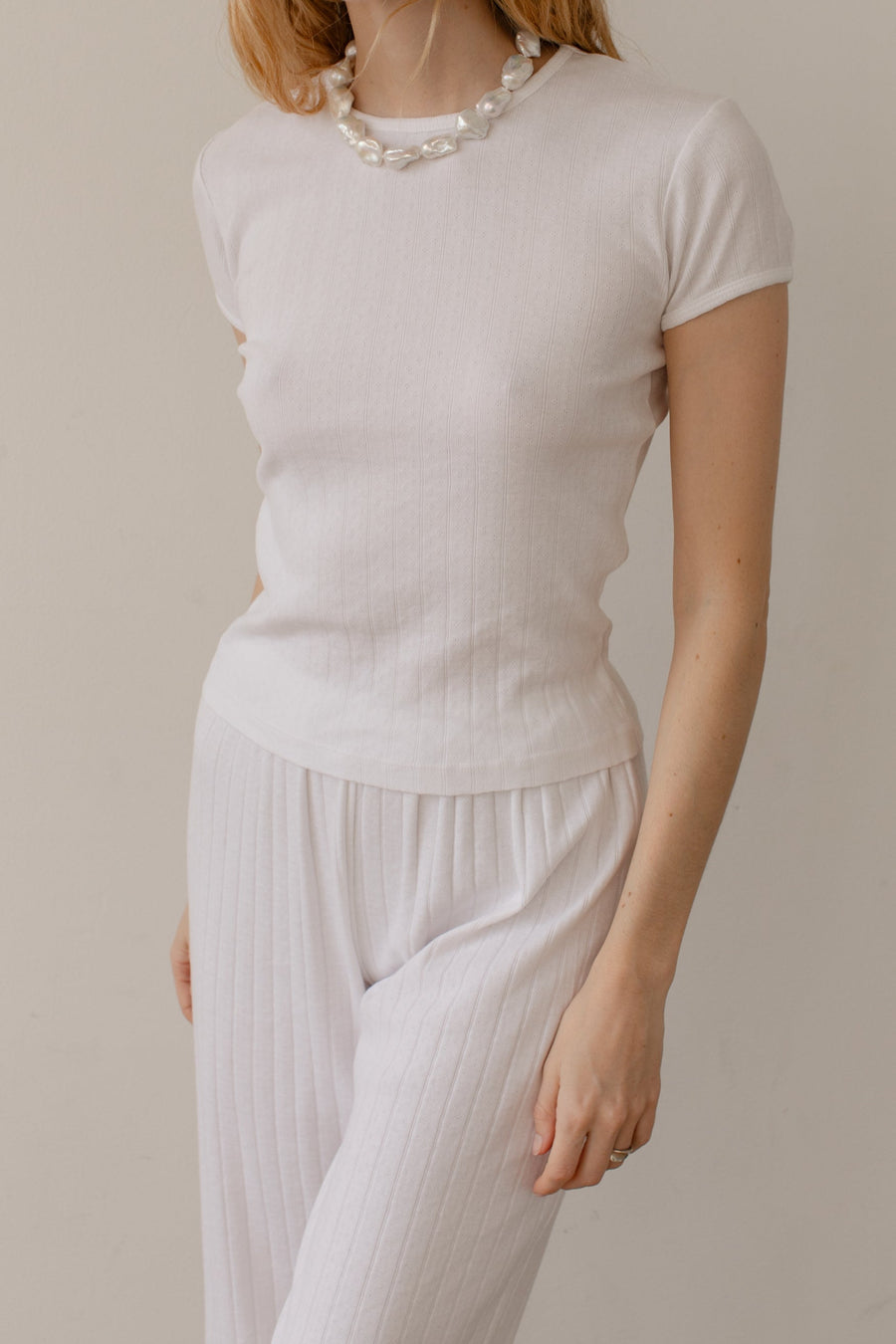DONNI. The Pointelle Baby Tee
