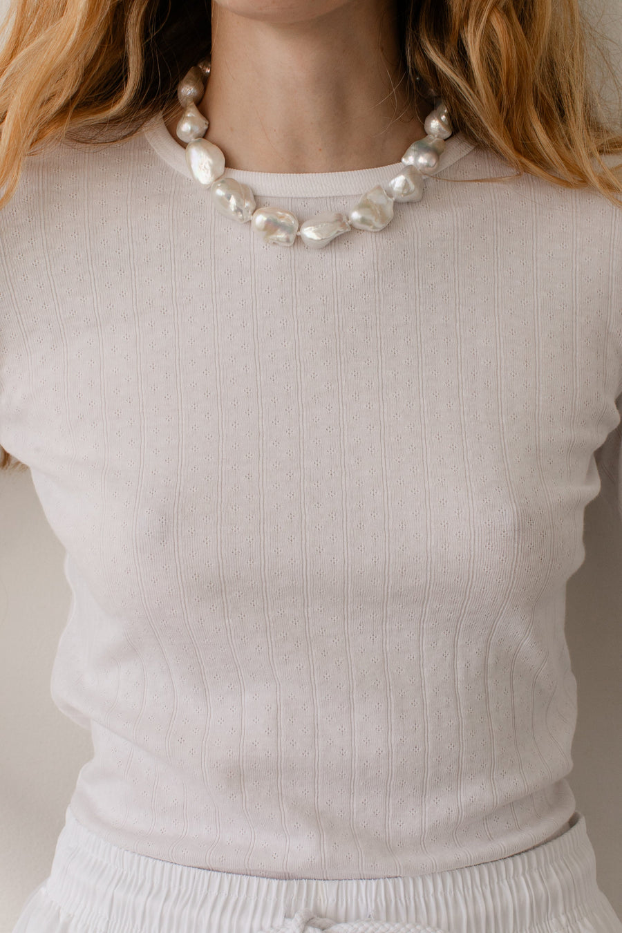 DONNI. The Pointelle Baby Tee